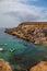 Famous Popeye village in Malta. Azure bay in the rocks.