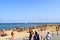 Famous public La Barceloneta beach with many people. Barcelona beach. Crowded beachfront in Spain, summer time