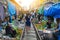 The famous railway market or folding umbrella market at Maeklong, Thailand, A famous market in Thailand and sixth times a day the