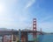 Famous red suspension Golden Gate Bridge in San Francisco, USA, on sunny day.