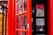 Famous red telephone box with person inside. Useful information about the calls inside the box