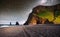 Famous Reynisdrangar rock formations at black Reynisfjara Beach. Coast of the Atlantic ocean near Vik, southern Iceland