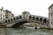 The famous Rialto Bridge Ponte di Rialto is one of the four bridges spanning the Grand Canal in Venice