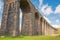 Famous Ribble Valley viaduct railway crossing showing detail of the stonework under-structure and guttering.