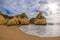 Famous rock formation with the cave on the beach of Tres Irmaos in Alvor, PortimÃ£o, Algarve, Portugal, Europe.