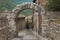 Famous roman arch Porta dei Cappuccini in Spello. Umbria, Italy
