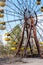 Famous rusty ferris wheel in abandoned amusement park in Pripyat, Chernobyl