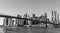 Famous Skyline of downtown New York City, Brooklin Bridge and Manhattan with skyscrapers illuminated over East River panorama. New