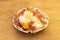 Famous Spanish dish of broken eggs with Serrano ham to share tapas style on a white bowl with black dots