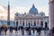 The famous St. Peter`s Square, Piazza San Pietro full of people with obelisk. Large plaza located directly in front of St. Peter