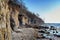 Famous steep coast cliff with washed out caves on the German island Poel in the Baltic Sea near Wismar, blue sky with copy space