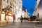 famous street Graben at night with the lights of shops and crowds of tourists walking around