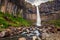 Famous Svartifoss waterfall, with its dark basalt walls, located