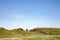 The famous Sycamore Gap tree on Hadrians Wall from a distance