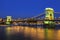 The famous szÃ©chenyi Chain bridge over the Danube river in the evening illumination. Budapest