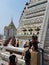 Famous temple of Wat Arun in Bangkok decorated with porcelain and tiles