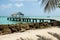 The famous thatched roofed jetty of Pigeon Point Beach in the Caribean sea on Tobago