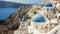 Famous three blue church domes in oia, santorini