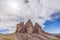 Famous three peak of Tre Cime di Lavaredo on the background of a beautiful sky. Italian Dolomites.