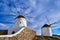 Famous tourist attraction, Mykonos, Greece. Two traditional whitewashed windmills. Summer, blue sky, beautiful cloud