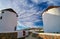 Famous tourist attraction of Mykonos, Greece. Two traditional whitewashed windmills. Travel destination, iconic view