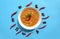 Famous traditional Arabic cuisine - peeled fava beans with chili in white bowl on blue background