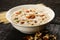 Famous and traditional Indian sweet pudding Kheer in a white bowl
