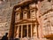 Famous Treasury of Petra. Place where there are always lot of tourists. Ancient building hollowed out in red stone