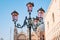 Famous venezian street lamps with pink glass in front of Basilica di San Marco in Venice, Italy