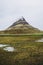 Famous view of Kirkjufellsfoss mountain. One of the most memorable sceneries to see and admire in Iceland. Dreamlike impressions