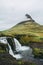 Famous view of Kirkjufellsfoss waterfall and mountain.