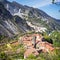 The famous village of Colonnata between white marble quarries of Carrara in the Apuan Alps. Massa Carrara. Tuscany, Italy