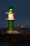 Famous Westmole lighthouse illuminated at night