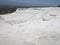 Famous white calcium travertines and pools in Pamukkale, Turkey.