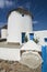 Famous windmills on the island of Mykonos, Greece. Wide shot with front gate