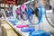 Fan for cooling in an electronics shop,various brands of electrical fans display on a shelf at supermarket in sunny hot summer day