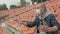 A fan in a medical mask sitting in an empty stadium is emotionally rooting for his favorite team.