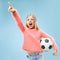 Fan sport teen player holding soccer ball isolated on blue background