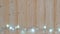 Fancy blinker light bulbs or garlands and wreath on wood table for Christmas or New years decoration background, Christmas colorfu