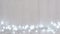 Fancy blinker light bulbs or garlands and wreath on wood table for Christmas or New years decoration background, Christmas colorfu