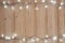 Fancy blinker light bulbs or garlands and wreath on wood table f