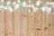 Fancy blinker light bulbs or garlands and wreath on wood table f