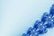 Fancy diagonal ribbon fractal in blue and white glitter, resembling flowers