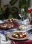 A fancy dinner for two: salad, brie cheese and white bread sandwiches