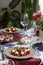 A fancy dinner for two: salad, brie cheese and white bread sandwiches