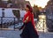 Fancy-dress actress in a medieval suit walks in Bruges, Belgium