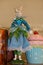 Fancy Easter Bunny Springtime fairy doll standing on kitchen shelf