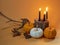 Fancy halloween pumpkins set design with black candles on orange