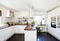 Fancy kitchen interior with wooden counter top and dar wooden floor white cupboards