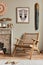 Fancy mediterranean interior of living room with mock up poster frame, design armchair, shelf, decoration, carpet.